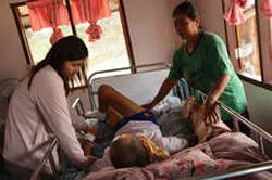 Access to Care team visiting a bedridden senior at home.