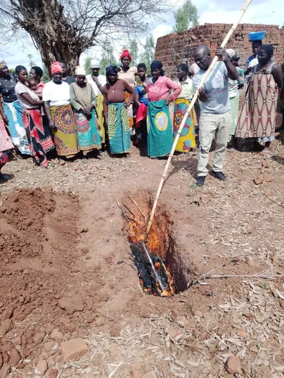 Farmers in Africa learning how to make biochar