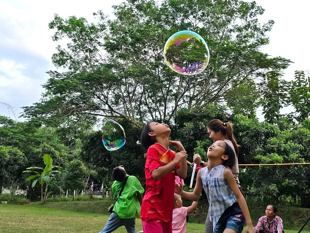 Spending the afternoon playing in our field with giant soap bubbles