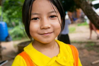 a hill tribe child receiving an education