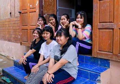 Children participating in educational activities at Warm Heart's community center in Thailand