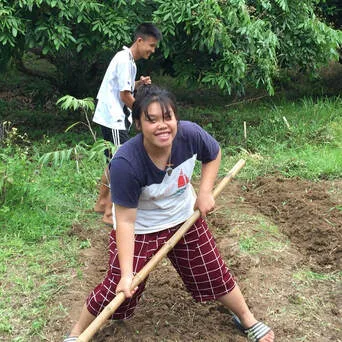 Children participating in sustainable agriculture training as part of the Young Smart Farmers program.